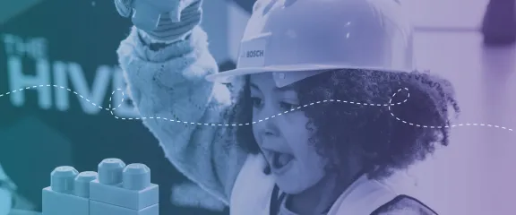 A young girl building with bricks