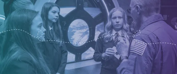 School pupils listen closely during a conversation with an astronaut in the space zone at Glasgow Science Centre